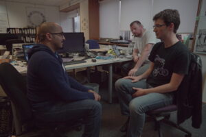 Office meeting, photo via Wikimedia Commons
