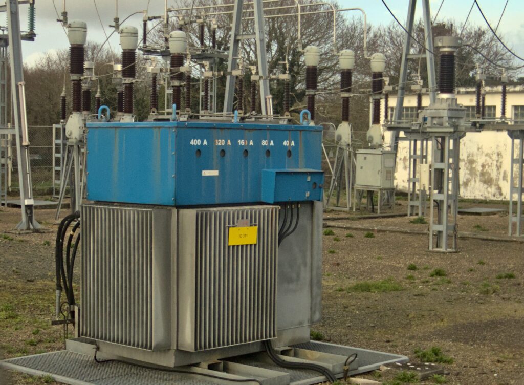 High-voltage substation, photo by PtiBzh via Wikimedia Commons