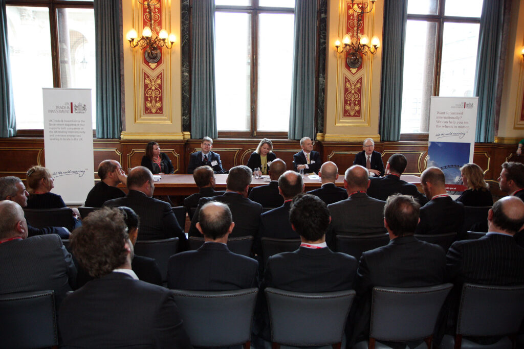 Business representatives meeting, official-source image via Wikimedia Commons