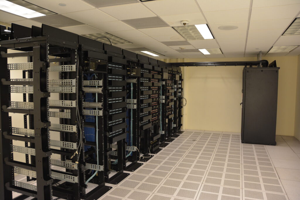 Data center server racks, photo by Tony Webster via Wikimedia Commons